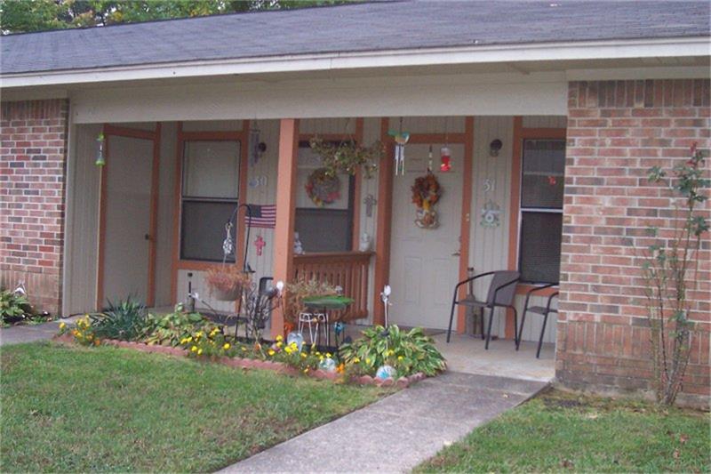 303 E Avenue Hooks, TX 75561 - Photo 7 of 19 a view of a house with a yard and sitting area