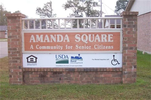 a sign on the brick wall