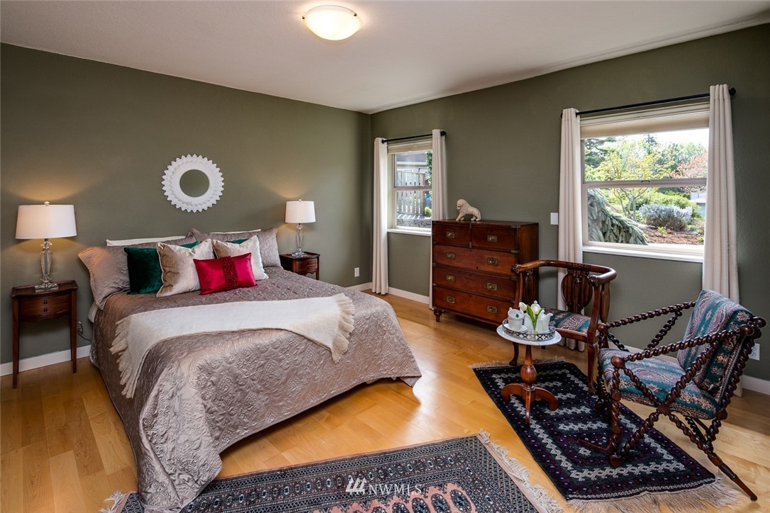 710 Fieldston Road Bellingham, WA 98225 - Photo 14 of 27 a bedroom with a bed and wooden floor