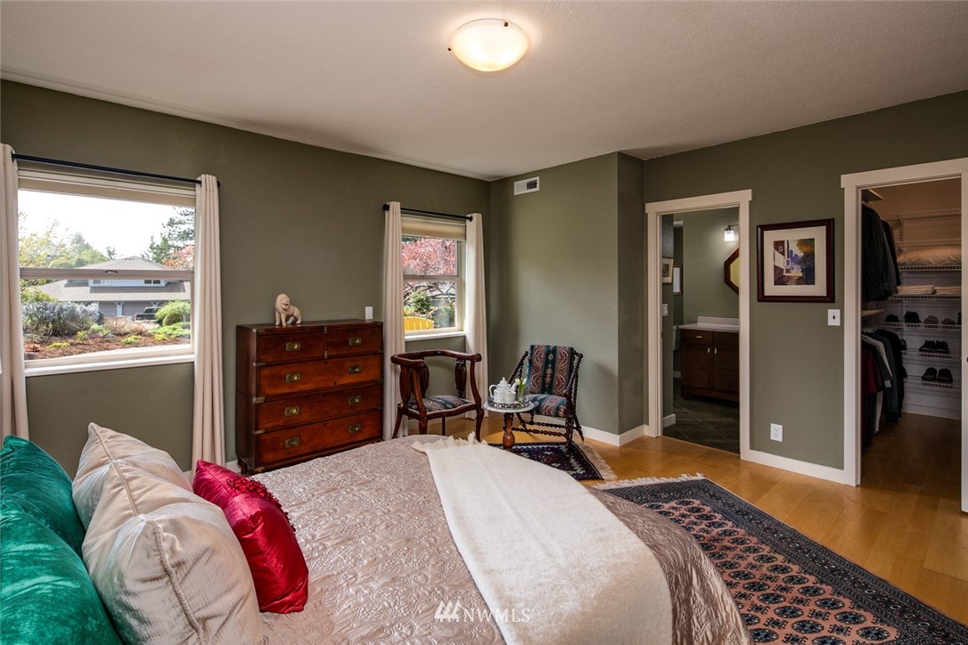 710 Fieldston Road Bellingham, WA 98225 - Photo 15 of 27 a bedroom with a bed and wooden floor
