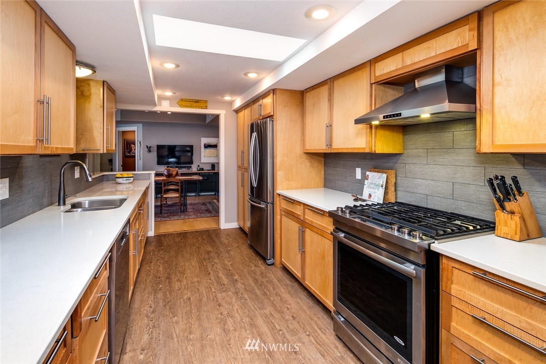 710 Fieldston Road Bellingham, WA 98225 - Photo 6 of 27 a kitchen with stainless steel appliances a sink stove and refrigerator