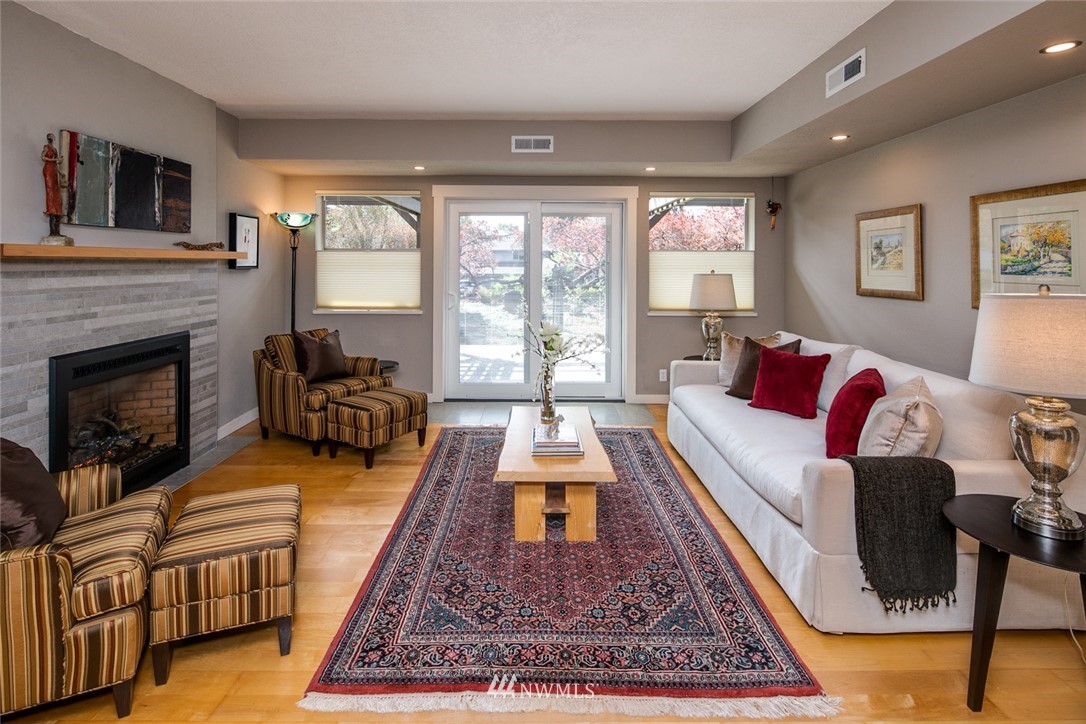 710 Fieldston Road Bellingham, WA 98225 - Photo 8 of 27 a living room with furniture large window and a fireplace