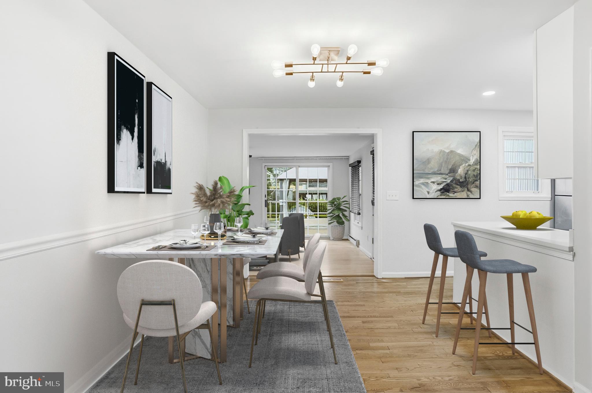 3339 Acton Road Parkville, MD 21234 - Photo 11 of 37 a view of a dining room with furniture and wooden floor