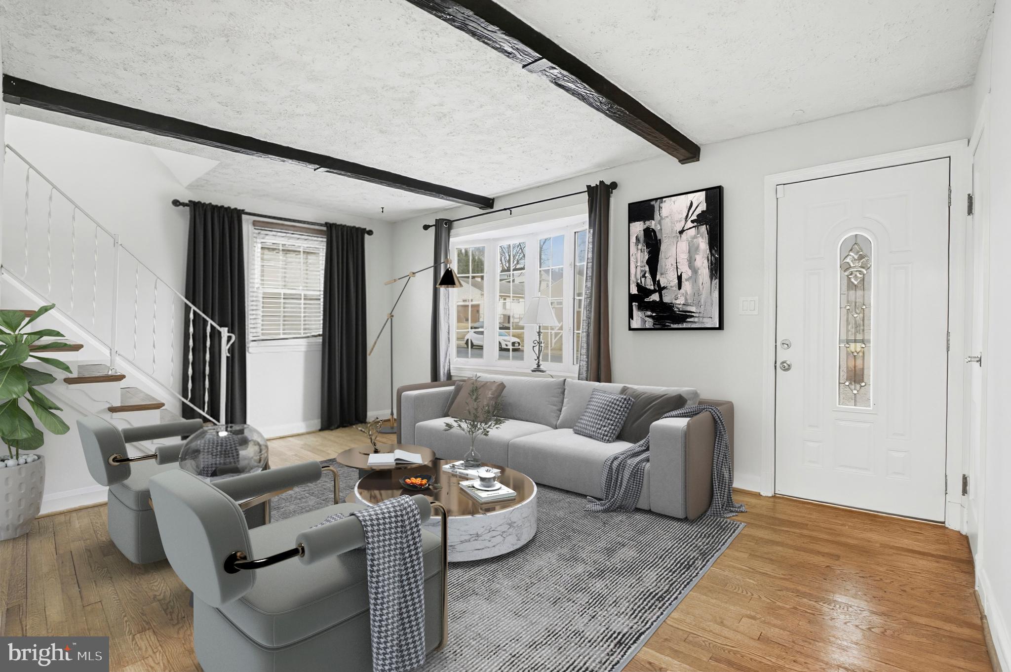 3339 Acton Road Parkville, MD 21234 - Photo 13 of 37 a living room with furniture and a rug