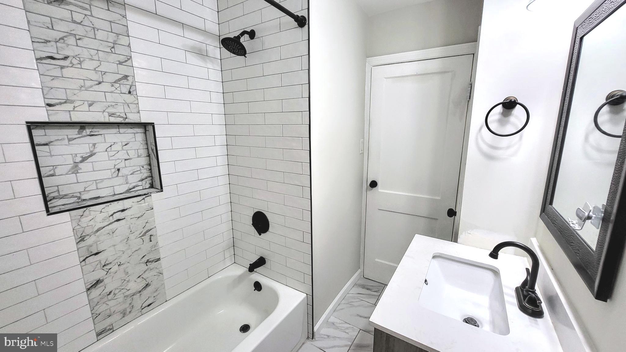 3339 Acton Road Parkville, MD 21234 - Photo 14 of 37 a bathroom with a sink a toilet and shower