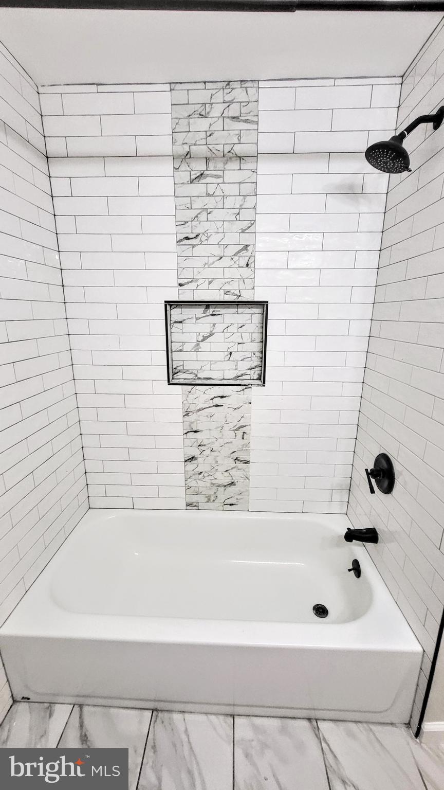 3339 Acton Road Parkville, MD 21234 - Photo 16 of 37 a bathroom with a bathtub