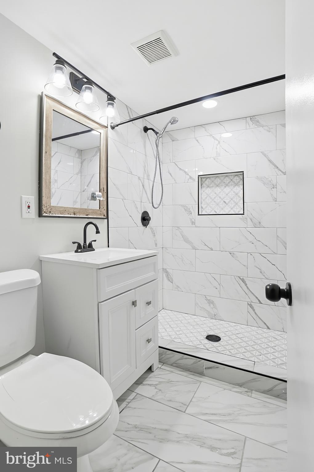 3339 Acton Road Parkville, MD 21234 - Photo 20 of 37 a bathroom with a sink toilet and shower