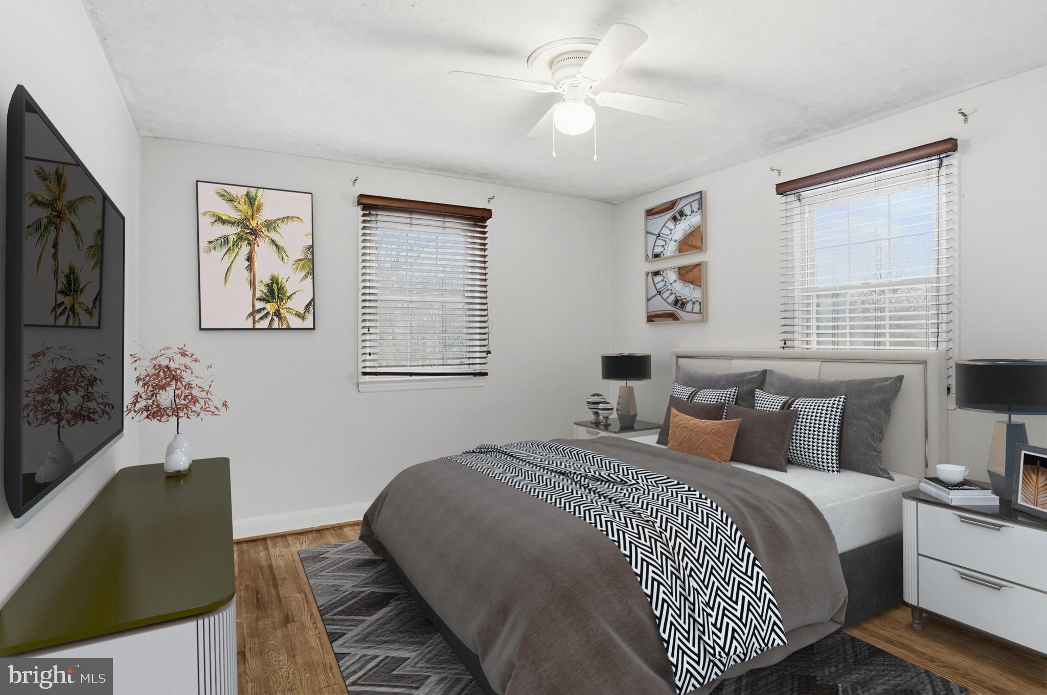 3339 Acton Road Parkville, MD 21234 - Photo 22 of 37 a bedroom with bed and window