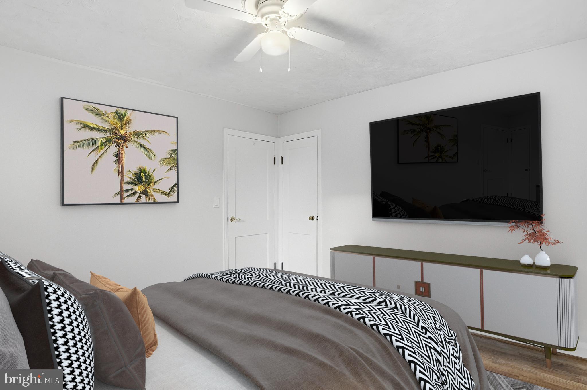 3339 Acton Road Parkville, MD 21234 - Photo 23 of 37 a bedroom with a bed and a flat screen tv