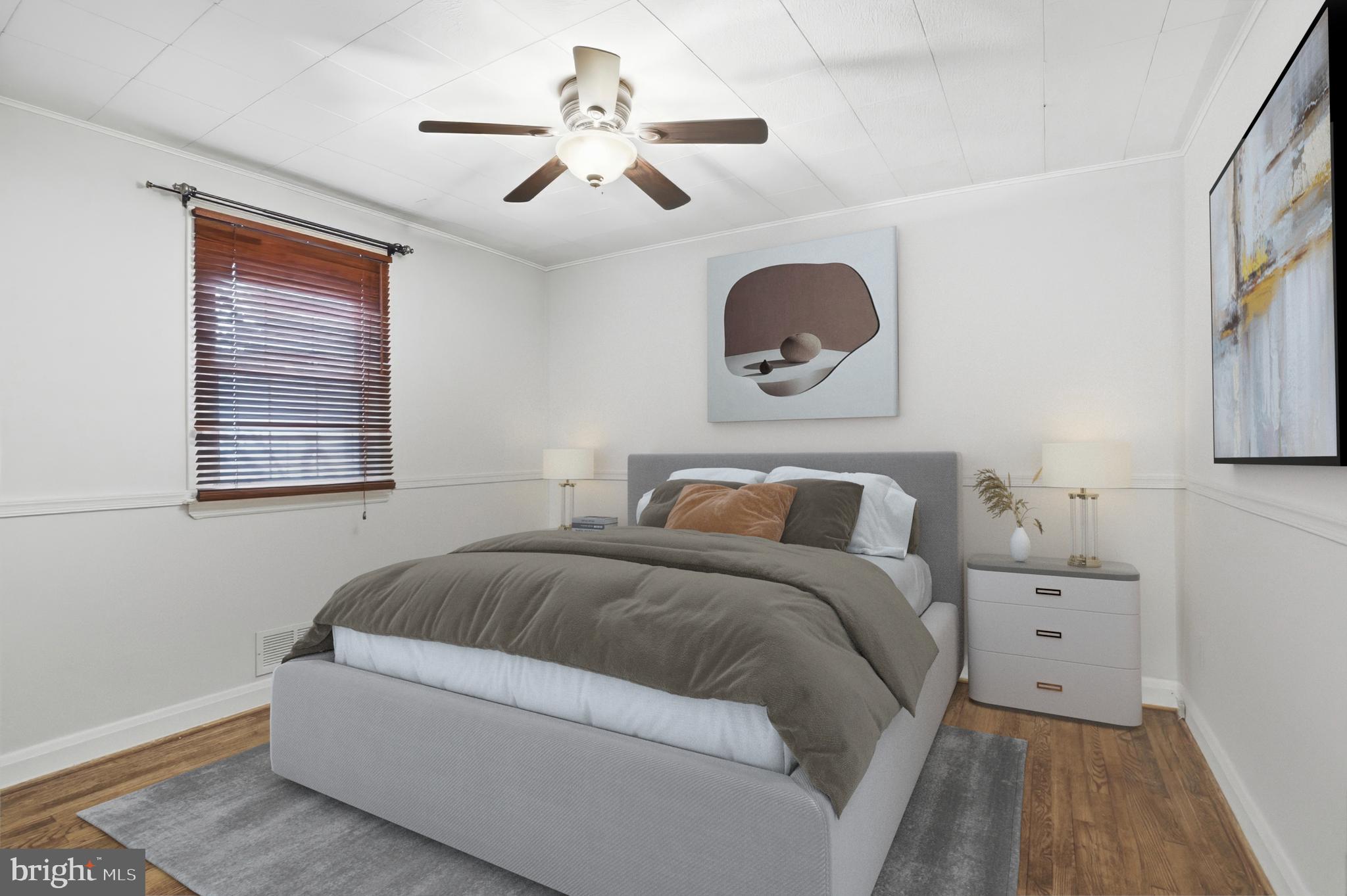 3339 Acton Road Parkville, MD 21234 - Photo 24 of 37 a bedroom with a bed and a chandelier