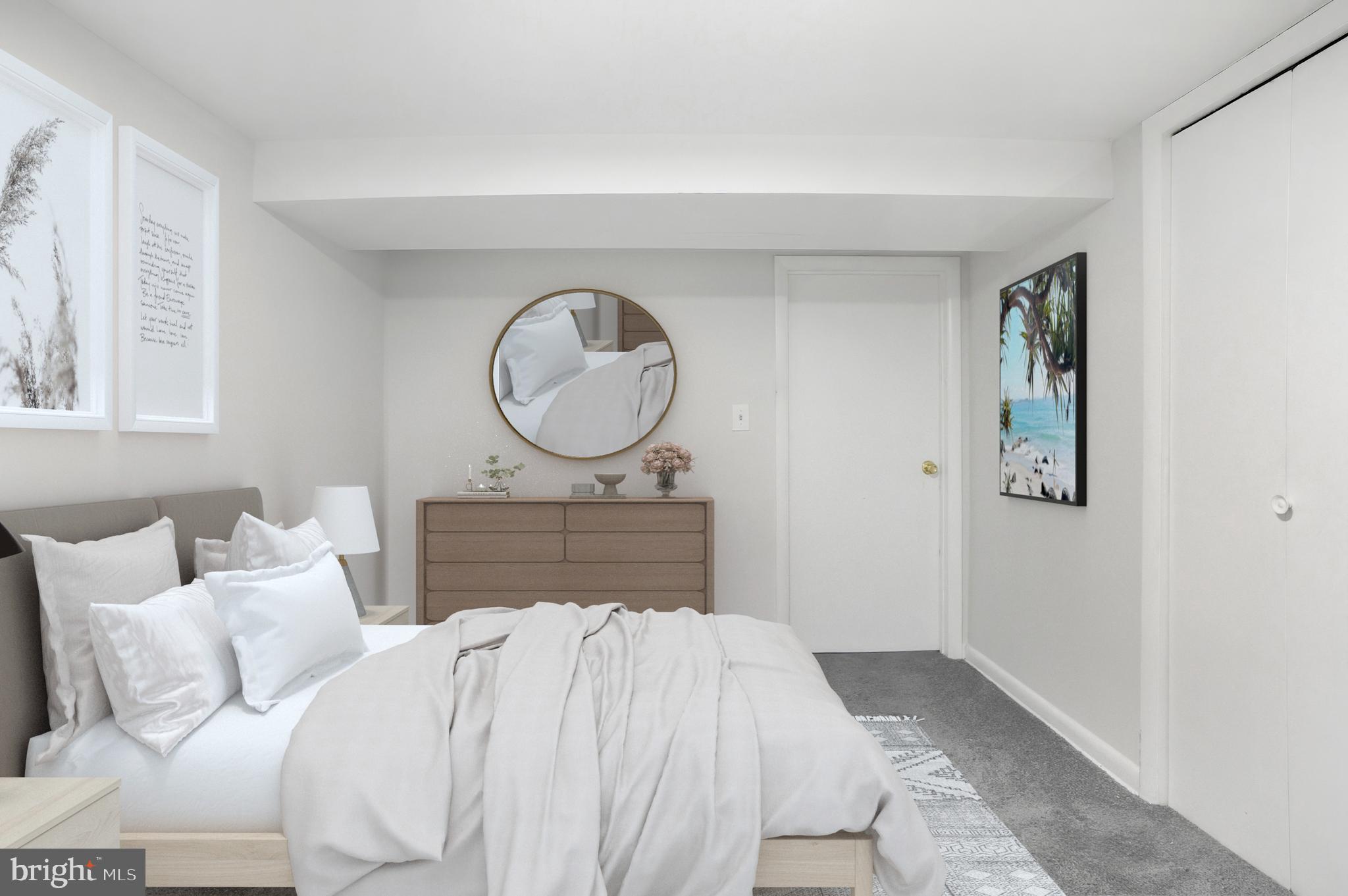 3339 Acton Road Parkville, MD 21234 - Photo 29 of 37 a bedroom with a bed and a chandelier