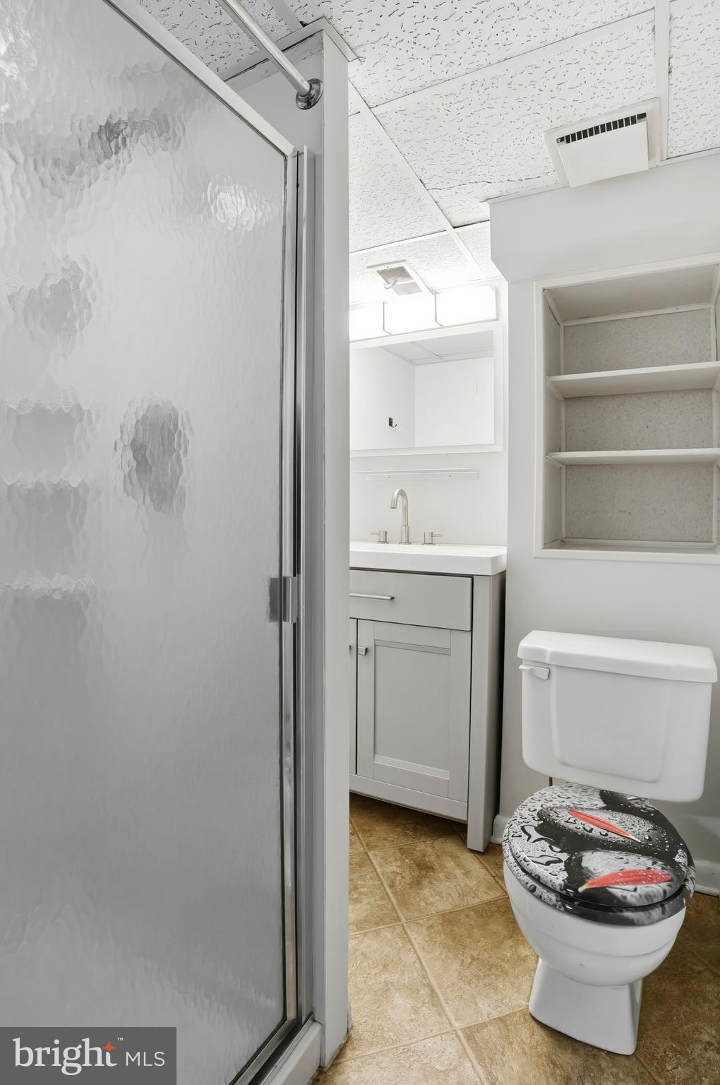 3339 Acton Road Parkville, MD 21234 - Photo 31 of 37 a bathroom with a sink a toilet and shower