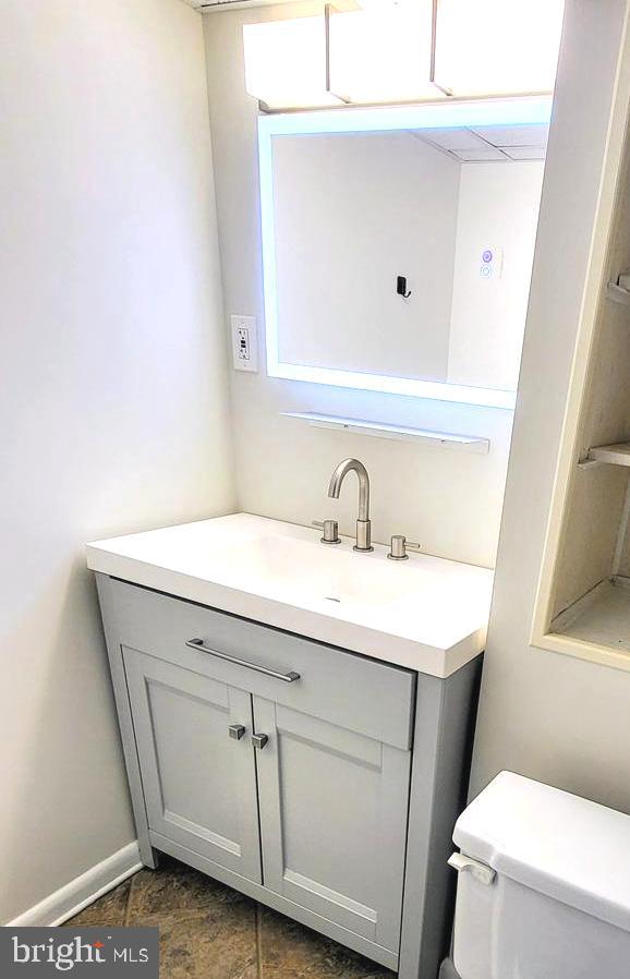 3339 Acton Road Parkville, MD 21234 - Photo 32 of 37 a bathroom with a sink a toilet and mirror