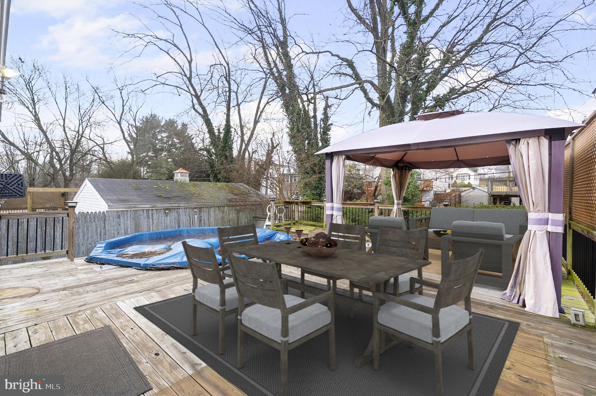 3339 Acton Road Parkville, MD 21234 - Photo 35 of 37 a view of a patio with chairs and a table