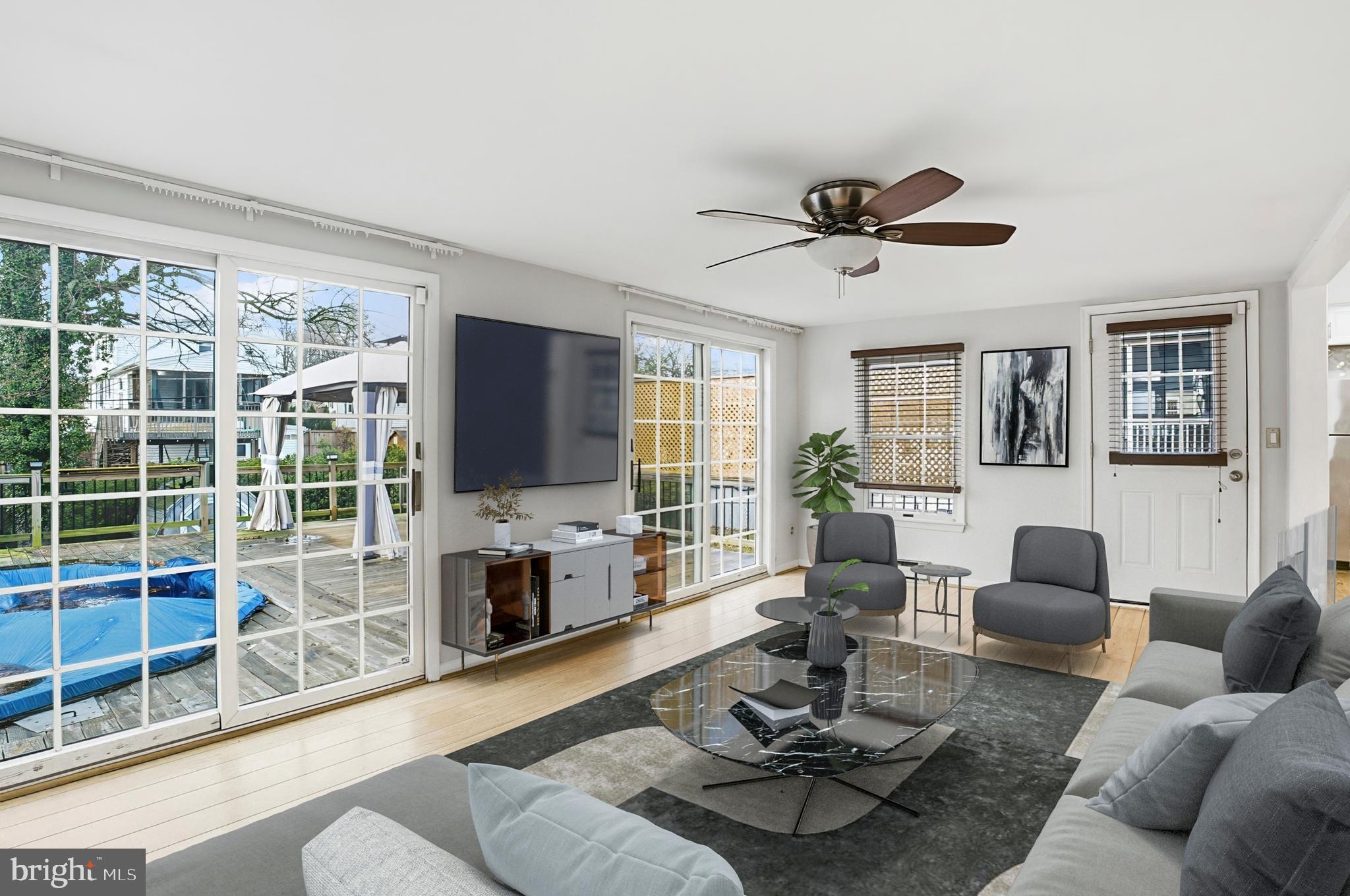3339 Acton Road Parkville, MD 21234 - Photo 5 of 37 a living room with furniture a fireplace and a flat screen tv