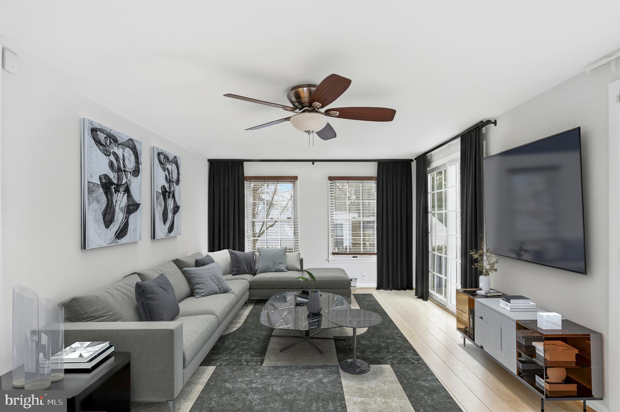 3339 Acton Road Parkville, MD 21234 - Photo 6 of 37 a living room with furniture and a flat screen tv