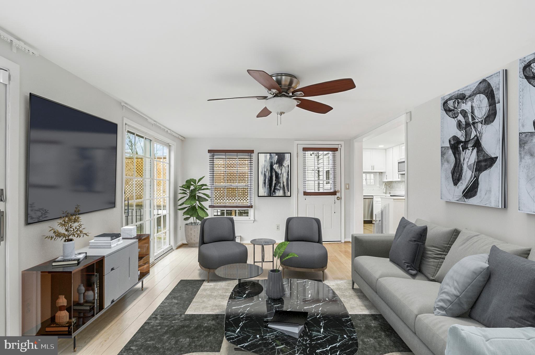 3339 Acton Road Parkville, MD 21234 - Photo 7 of 37 a living room with furniture a ceiling fan and a flat screen tv