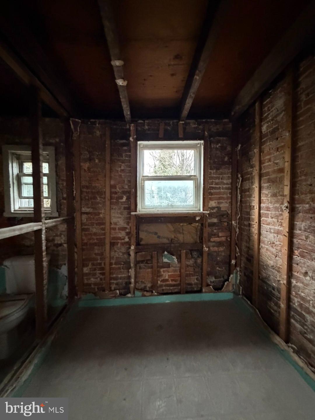 1608 Lemmon Street Baltimore, MD 21223 - Photo 15 of 21 a room with lot of furniture and a window