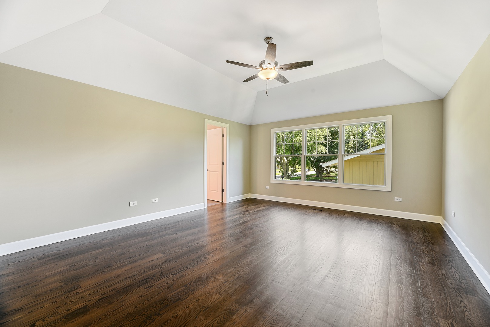 440 West Gartner Road Naperville, IL 60540 - Photo 11 of 22 a view of an empty room with wooden floor and a window
