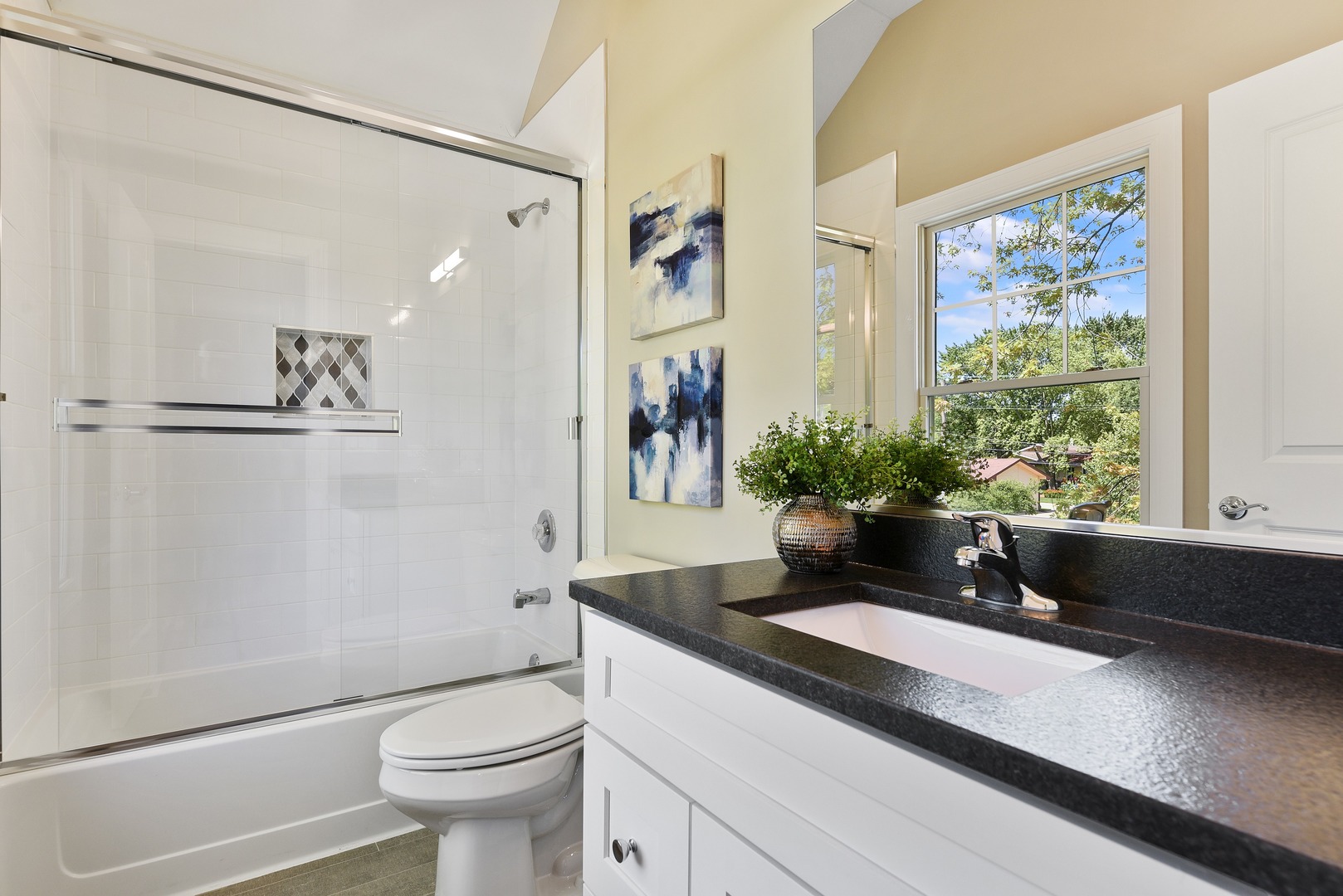 440 West Gartner Road Naperville, IL 60540 - Photo 12 of 22 a bathroom with a granite countertop sink a toilet a large mirror and shower
