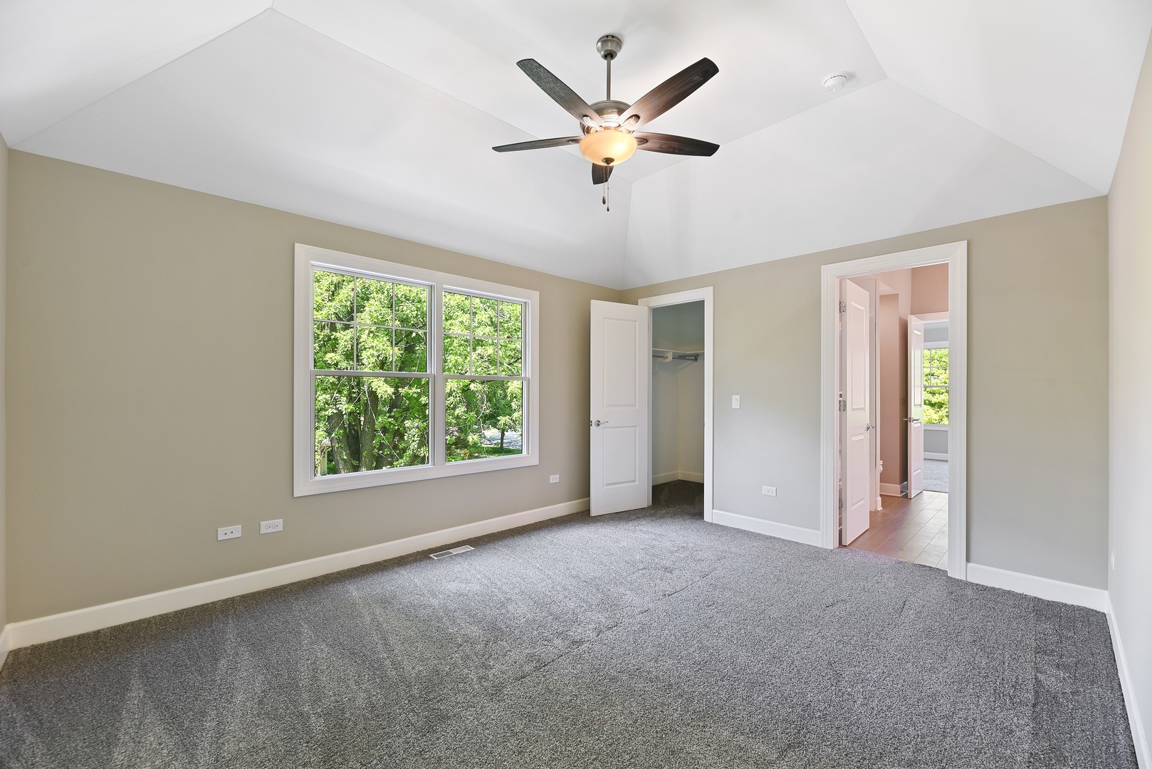 440 West Gartner Road Naperville, IL 60540 - Photo 13 of 22 a view of a livingroom with a ceiling fan and window