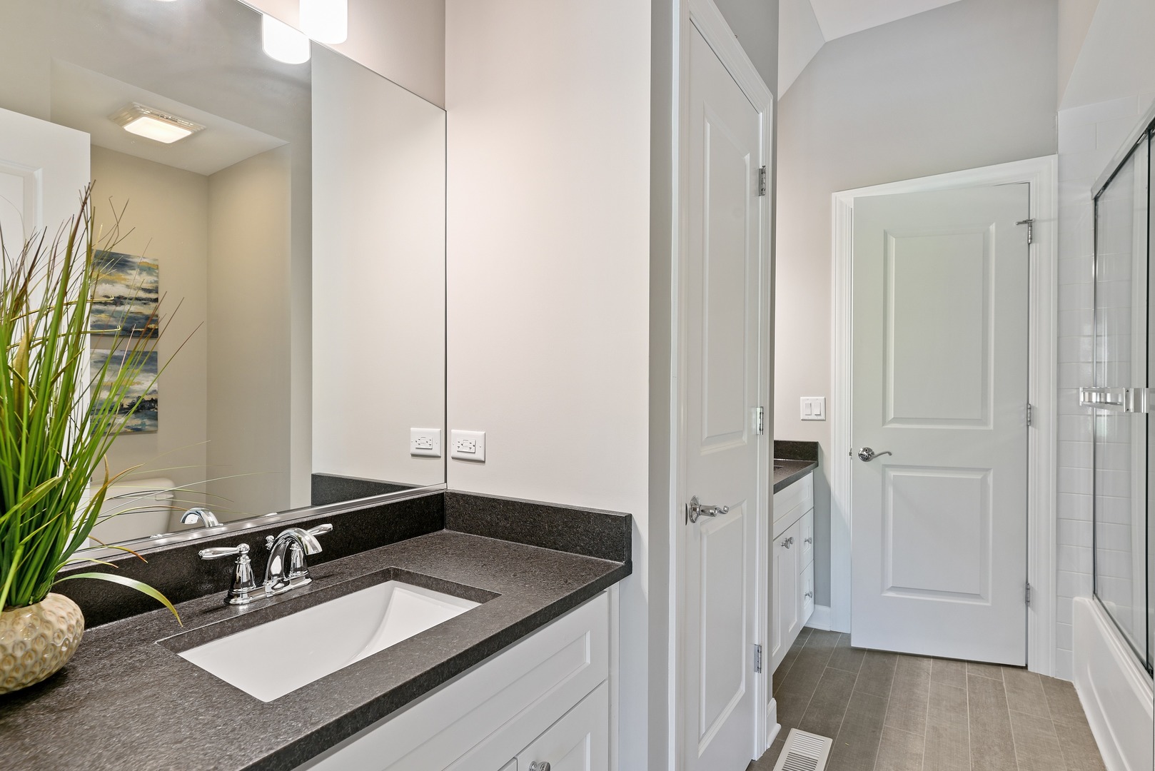 440 West Gartner Road Naperville, IL 60540 - Photo 14 of 22 a bathroom with a sink and a mirror