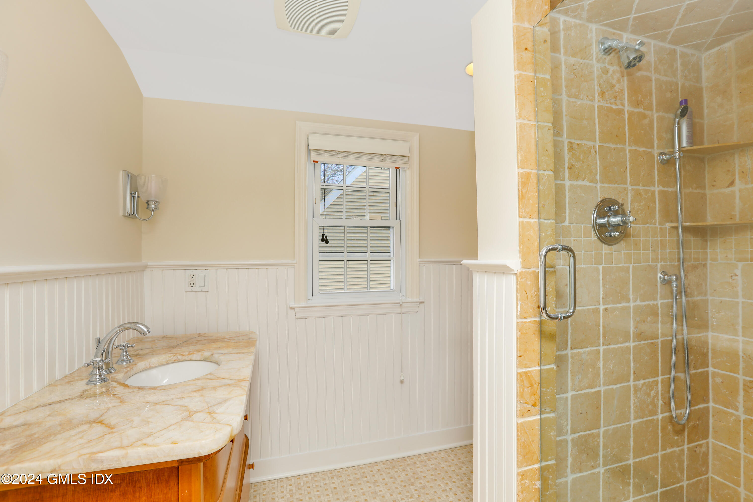 13 Riverside Lane Riverside, CT 06878 - Photo 18 of 25 a bathroom with a granite countertop shower a sink and a mirror