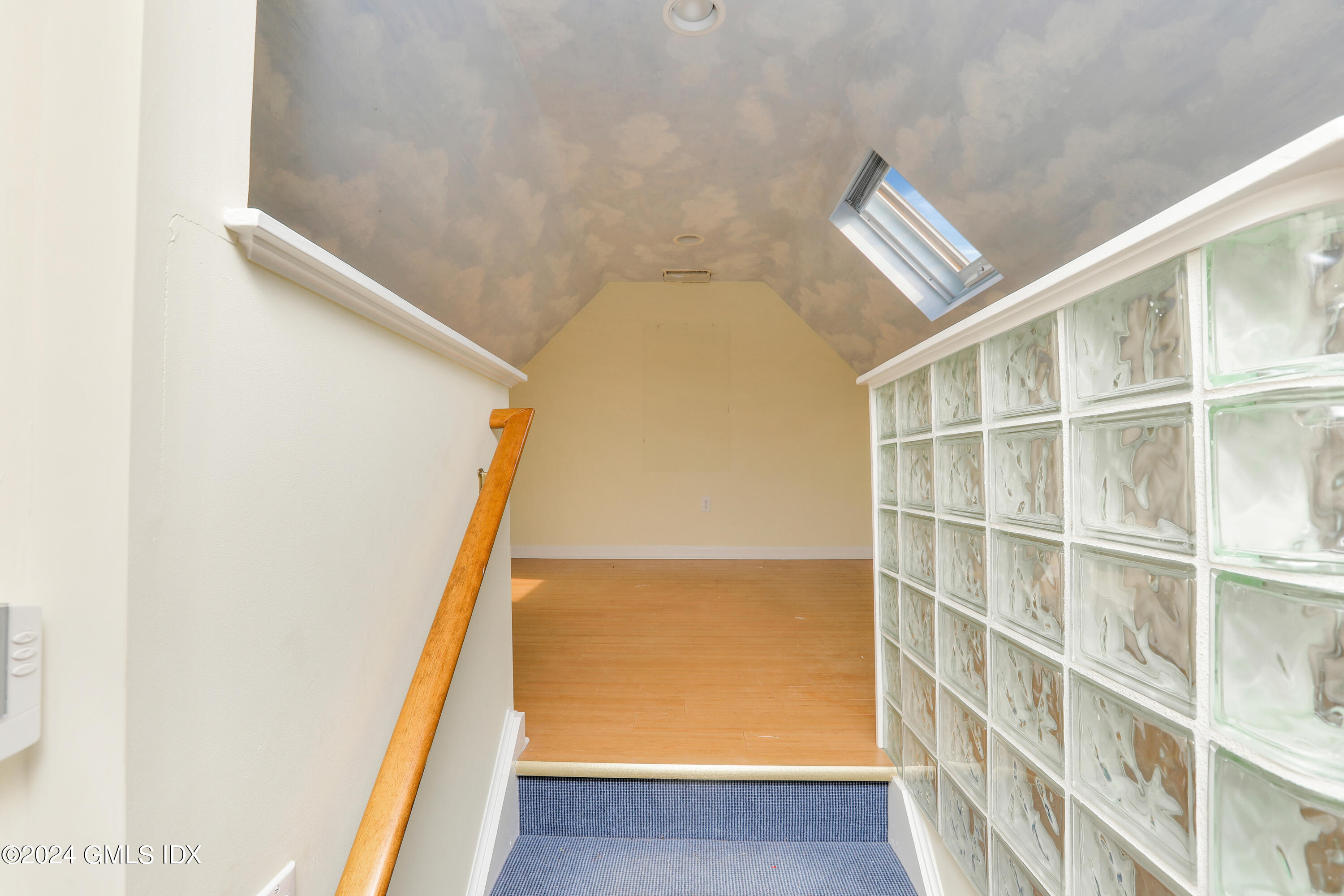 13 Riverside Lane Riverside, CT 06878 - Photo 20 of 25 a view of staircase with white walls and a window