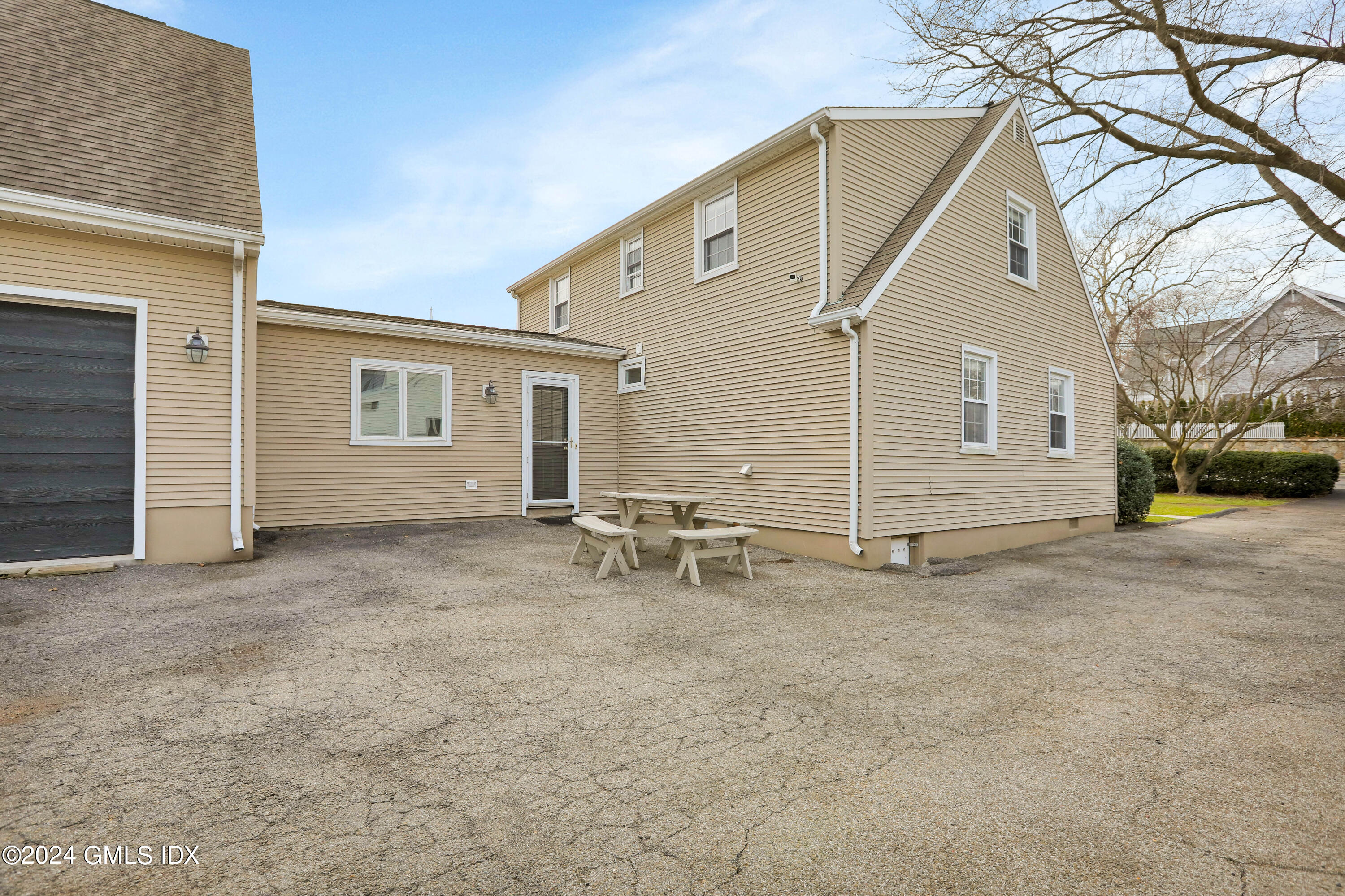 13 Riverside Lane Riverside, CT 06878 - Photo 2 of 25 a view of a house with a patio