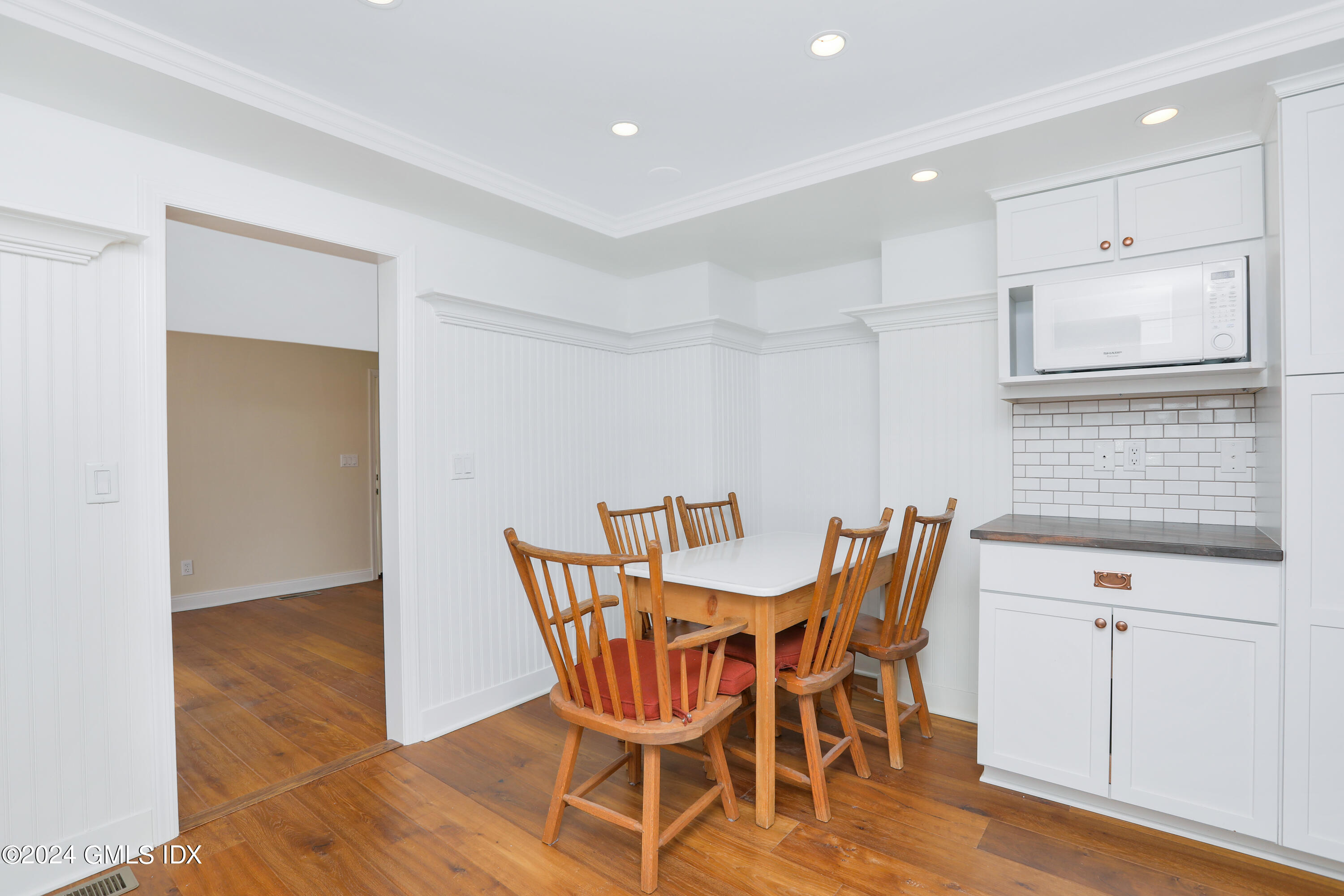 13 Riverside Lane Riverside, CT 06878 - Photo 7 of 25 a view of a dining room with furniture and wooden floor