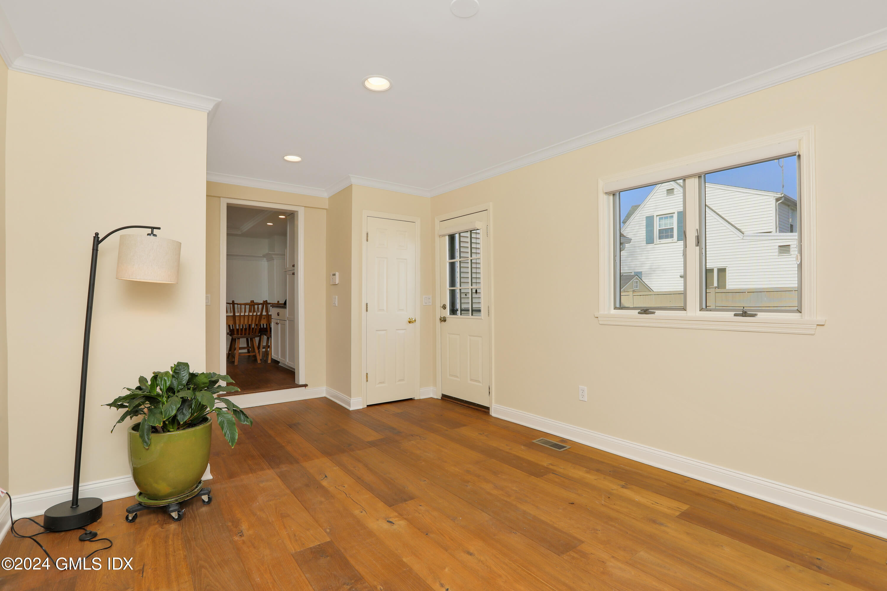 13 Riverside Lane Riverside, CT 06878 - Photo 8 of 25 a view of a room with a potted plant and wooden floor