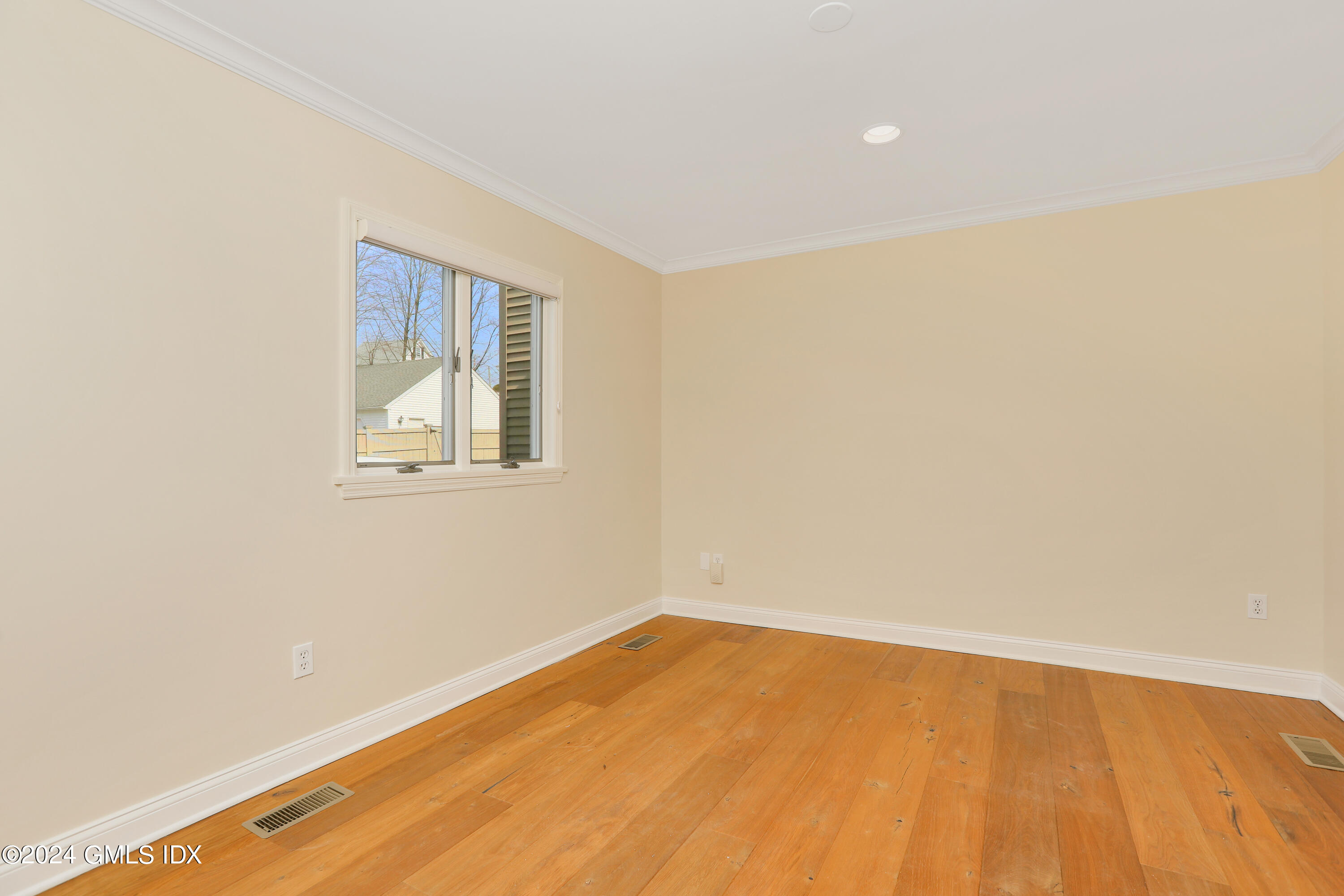 13 Riverside Lane Riverside, CT 06878 - Photo 9 of 25 a view of empty room with wooden floor and fan
