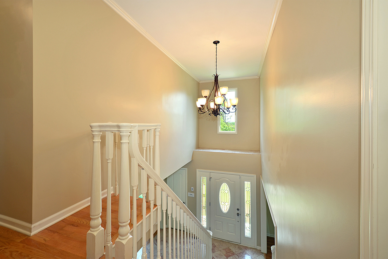 1435 Dunheath Drive Inverness, IL 60010 - Photo 11 of 27 a view of a hallway with a chandelier