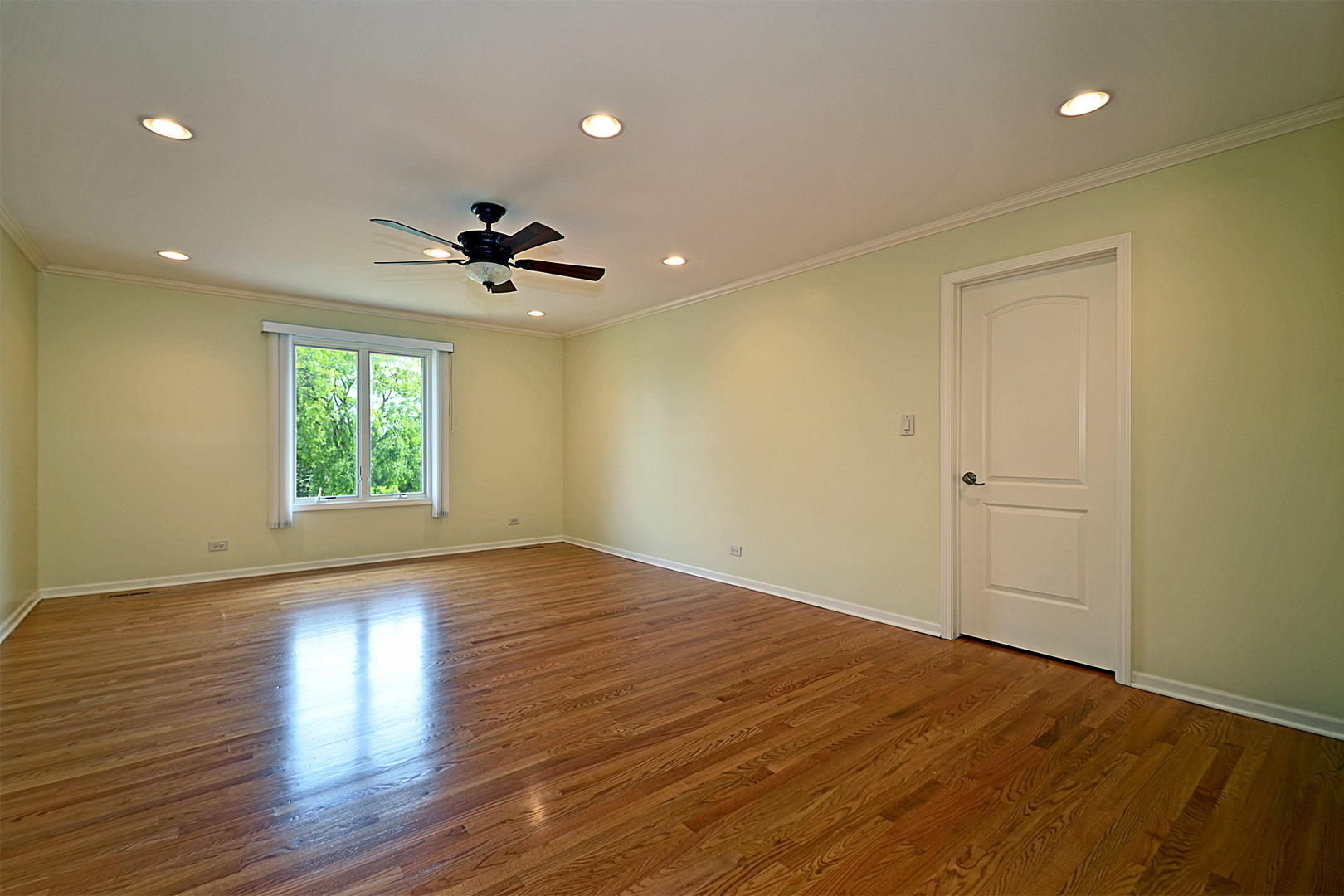 1435 Dunheath Drive Inverness, IL 60010 - Photo 12 of 27 a view of empty room with wooden floor and fan