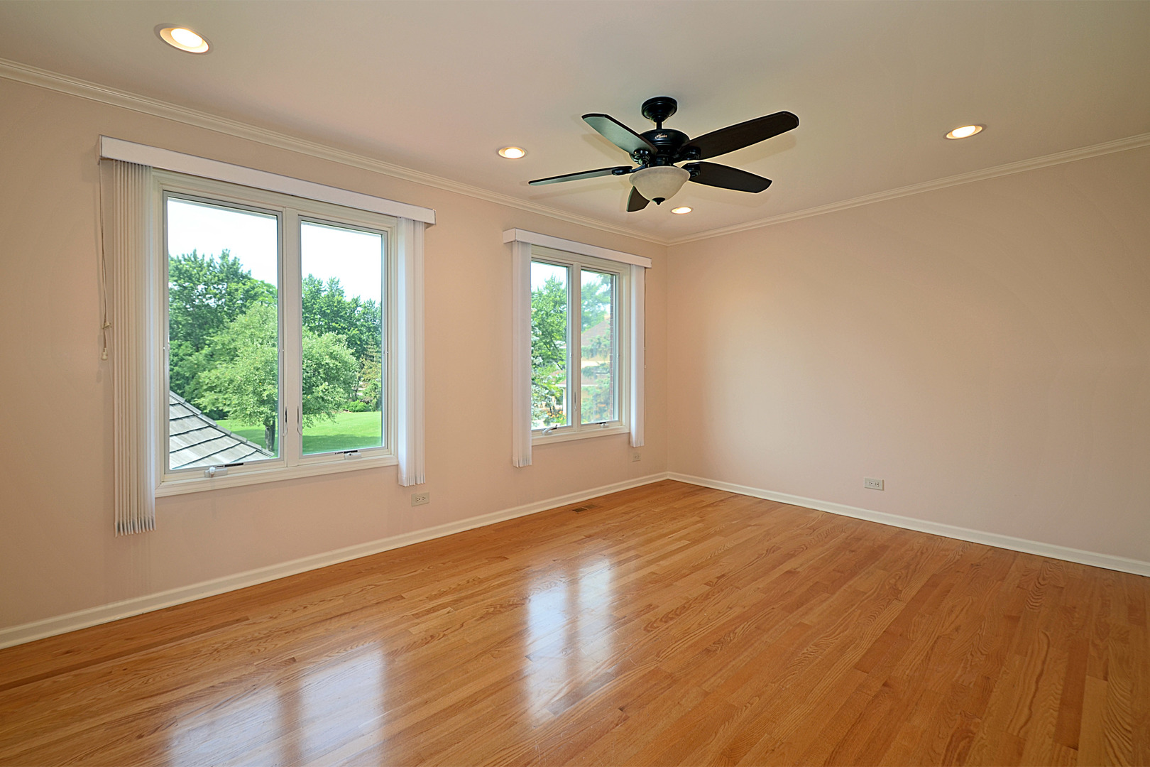 1435 Dunheath Drive Inverness, IL 60010 - Photo 14 of 27 a view of empty room with wooden floor and fan