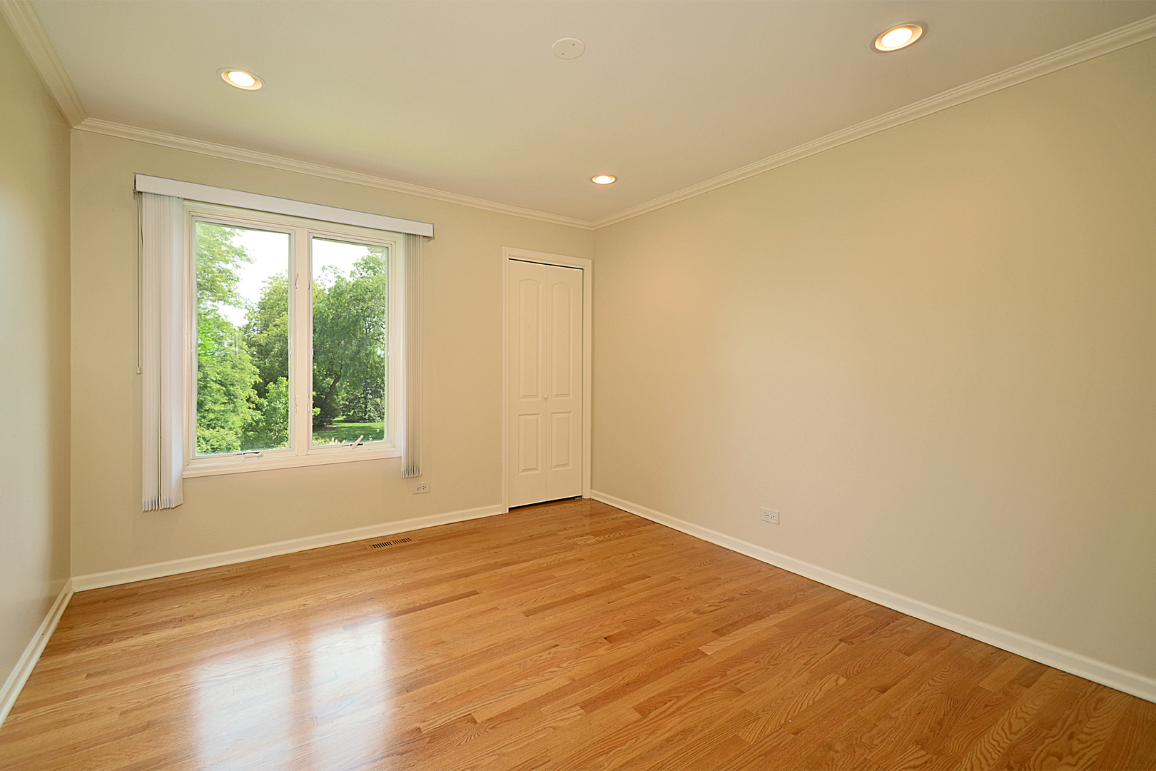1435 Dunheath Drive Inverness, IL 60010 - Photo 16 of 27 a view of empty room with wooden floor and fan