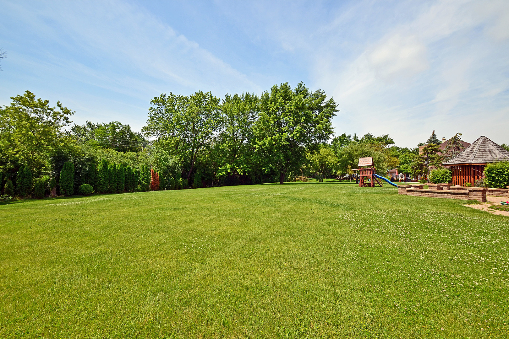 1435 Dunheath Drive Inverness, IL 60010 - Photo 26 of 27 a view of a green field with wooden fence