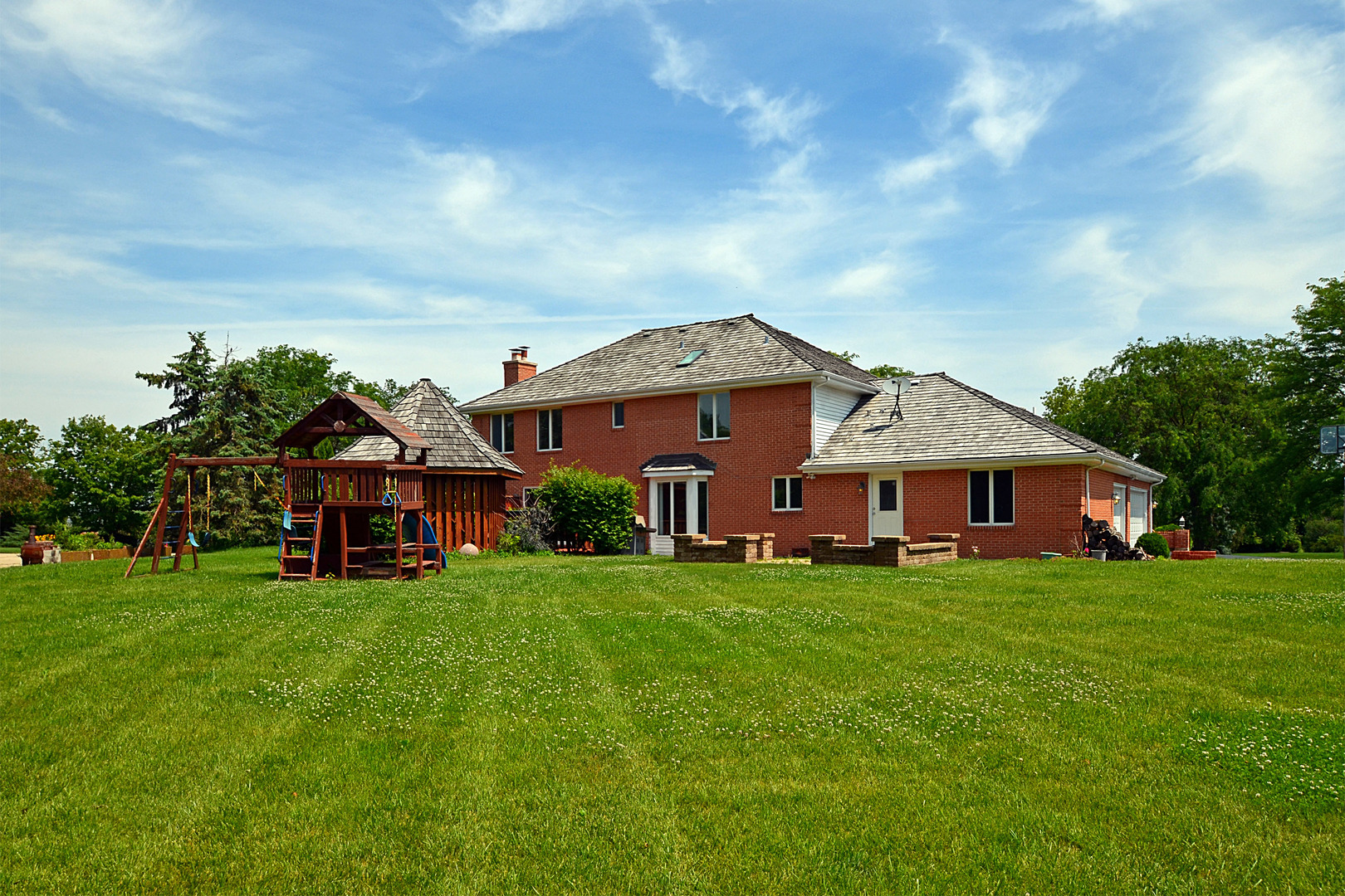 1435 Dunheath Drive Inverness, IL 60010 - Photo 27 of 27 a view of a house with a big yard and large trees