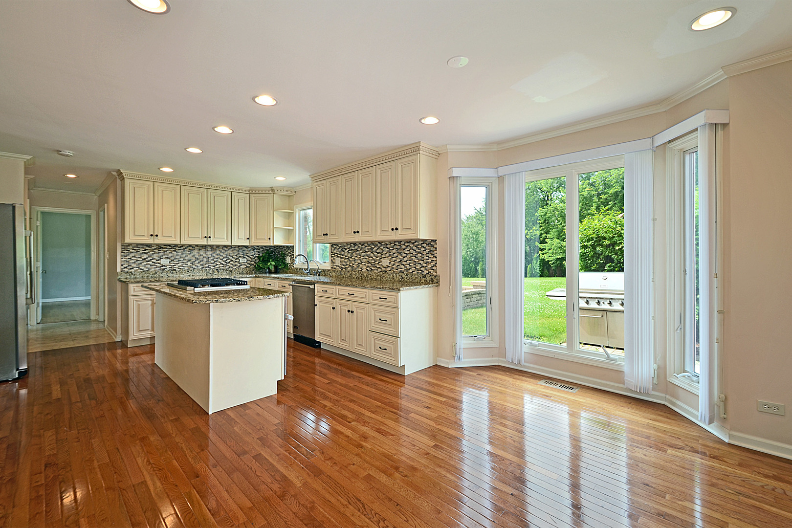 1435 Dunheath Drive Inverness, IL 60010 - Photo 4 of 27 a kitchen with a refrigerator and a stove top oven