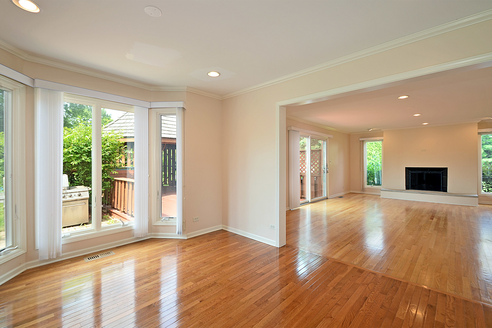 1435 Dunheath Drive Inverness, IL 60010 - Photo 5 of 27 a view of empty room with wooden floor and fireplace