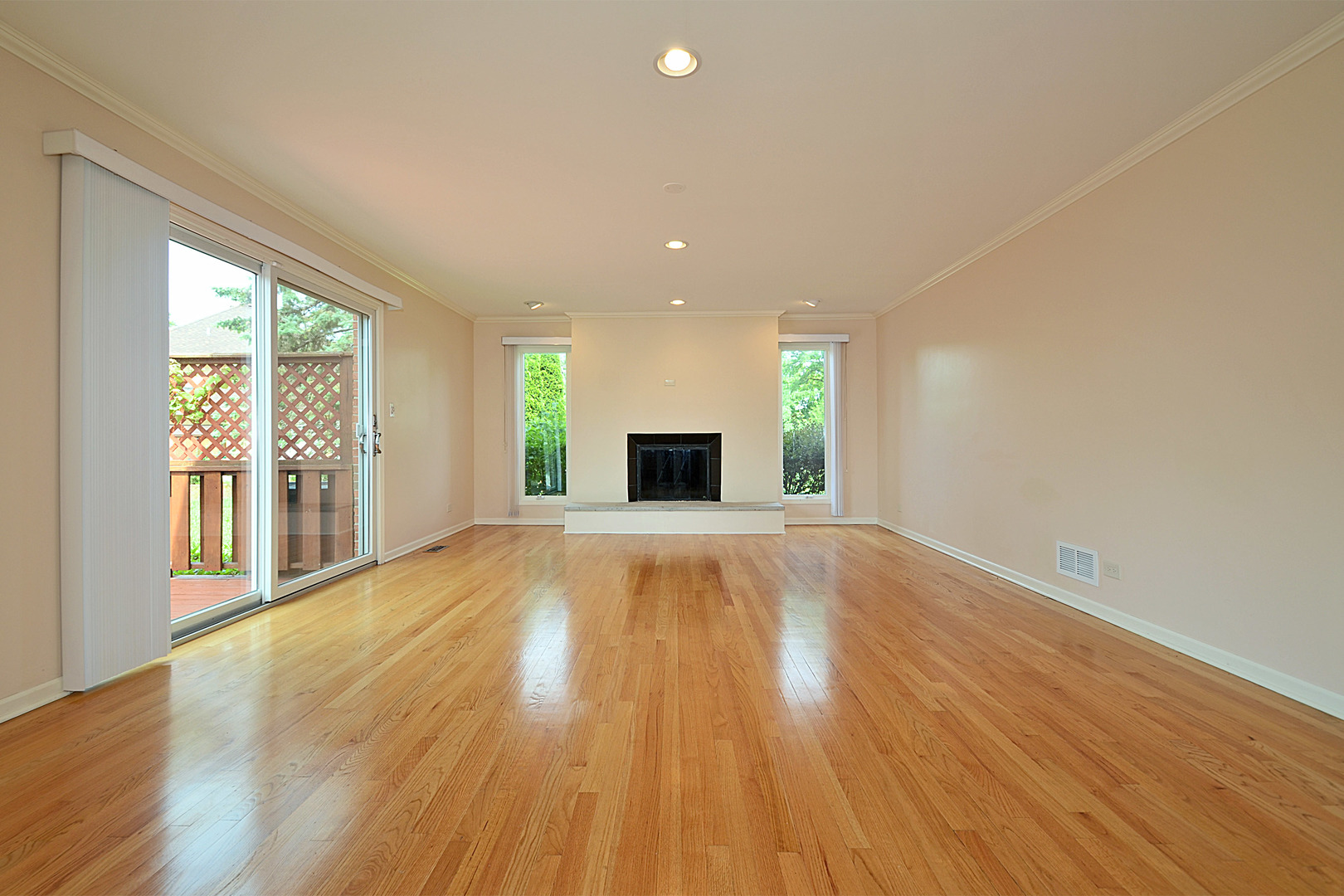 1435 Dunheath Drive Inverness, IL 60010 - Photo 6 of 27 a view of an empty room with wooden floor and a window
