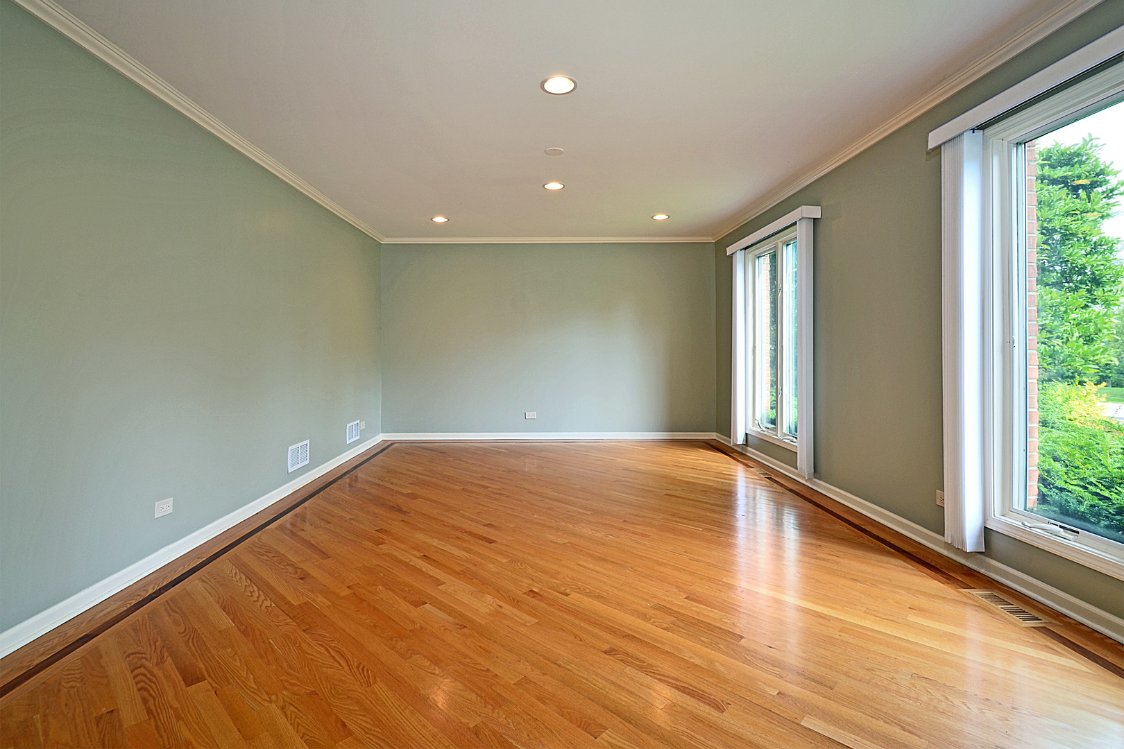 1435 Dunheath Drive Inverness, IL 60010 - Photo 7 of 27 a view of empty room with wooden floor and fan