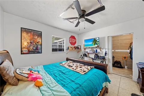 a bedroom with a bed furniture and a window