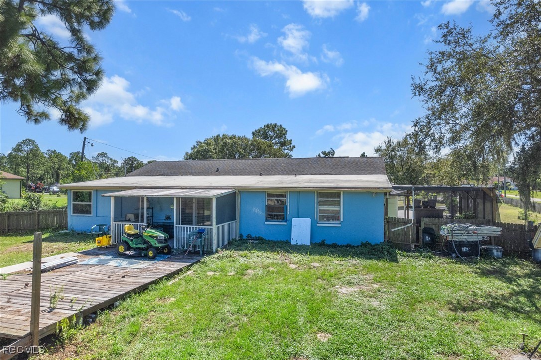 4121 16th Avenue Northeast Naples, FL 34120 - Photo 27 of 35 a view of a house with backyard and sitting area