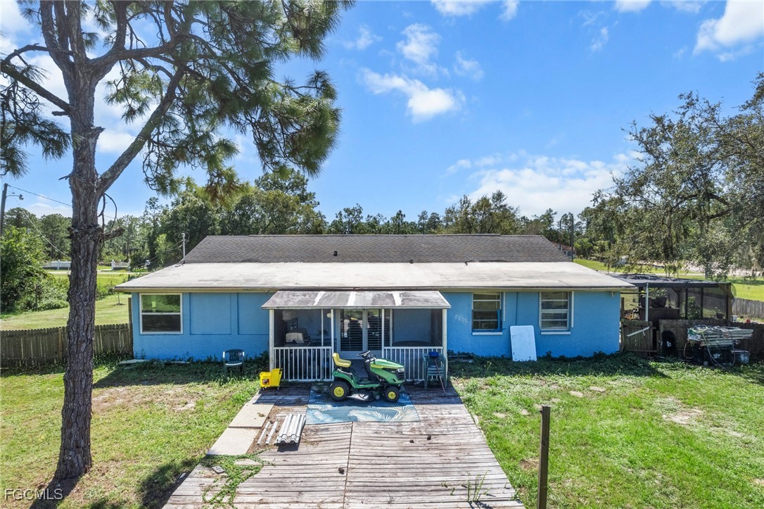 4121 16th Avenue Northeast Naples, FL 34120 - Photo 28 of 35 a front view of a house with garden