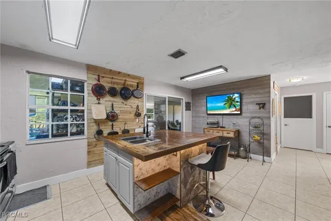 a kitchen with stainless steel appliances granite countertop a stove and a sink