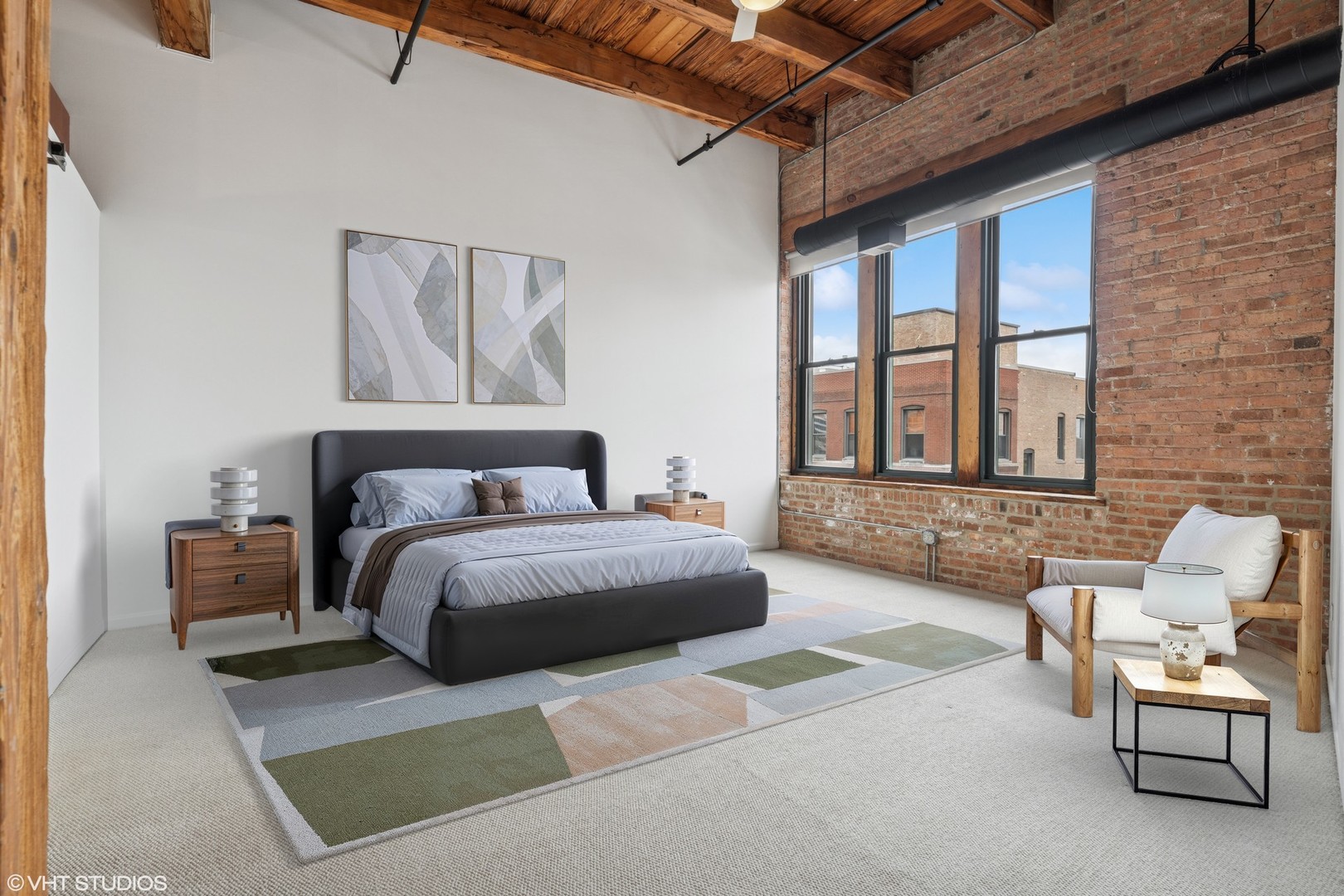 331 South Peoria Street, Unit PH6 Chicago, IL 60607 - Photo 13 of 46 a spacious bedroom with a bed and a couch