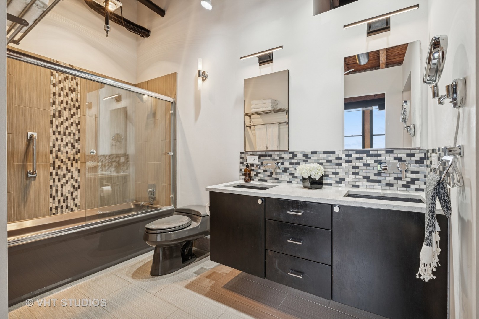 331 South Peoria Street, Unit PH6 Chicago, IL 60607 - Photo 16 of 46 a bathroom with a sink and a mirror