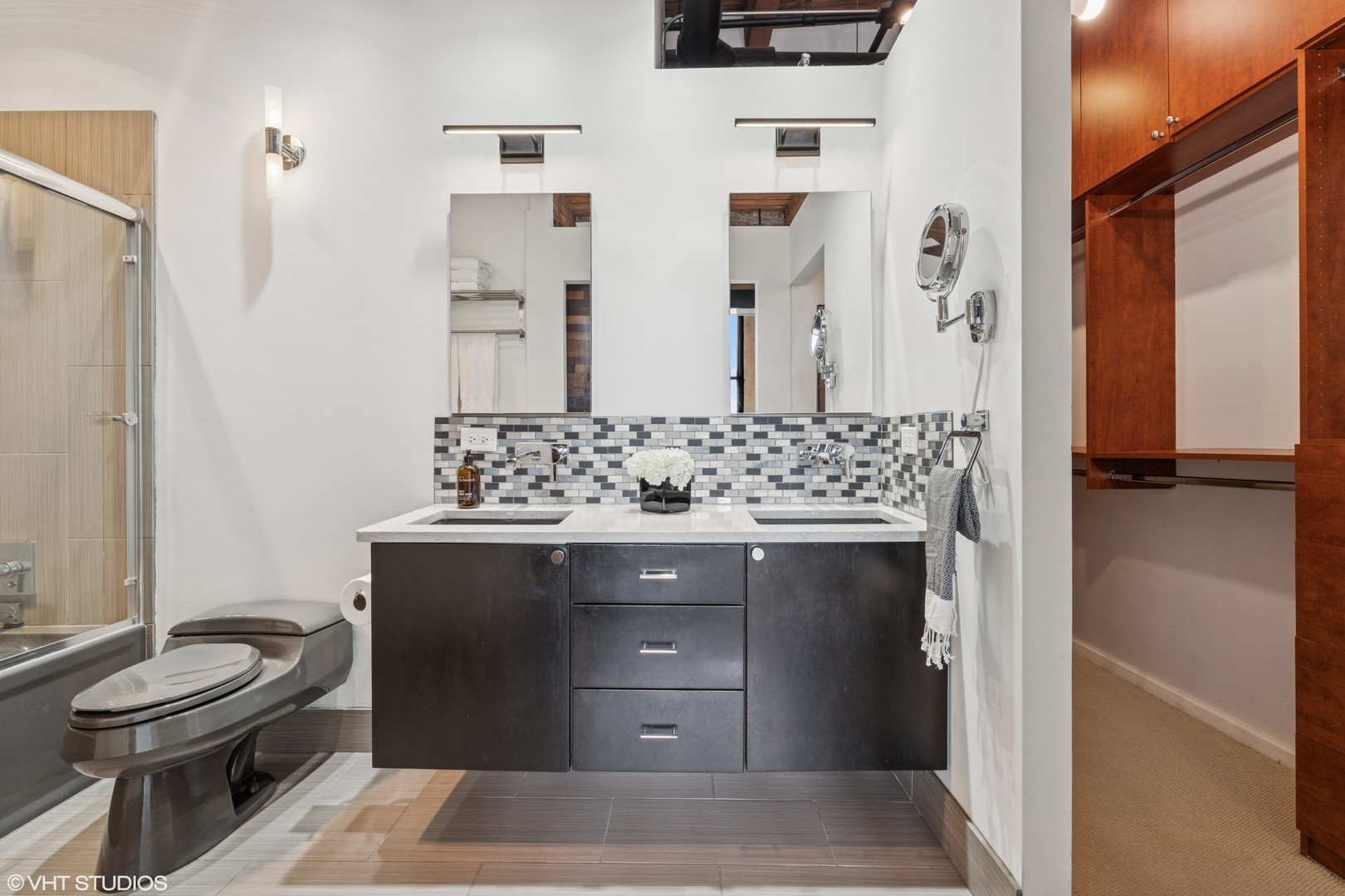 331 South Peoria Street, Unit PH6 Chicago, IL 60607 - Photo 17 of 46 a bathroom with a sink and a mirror