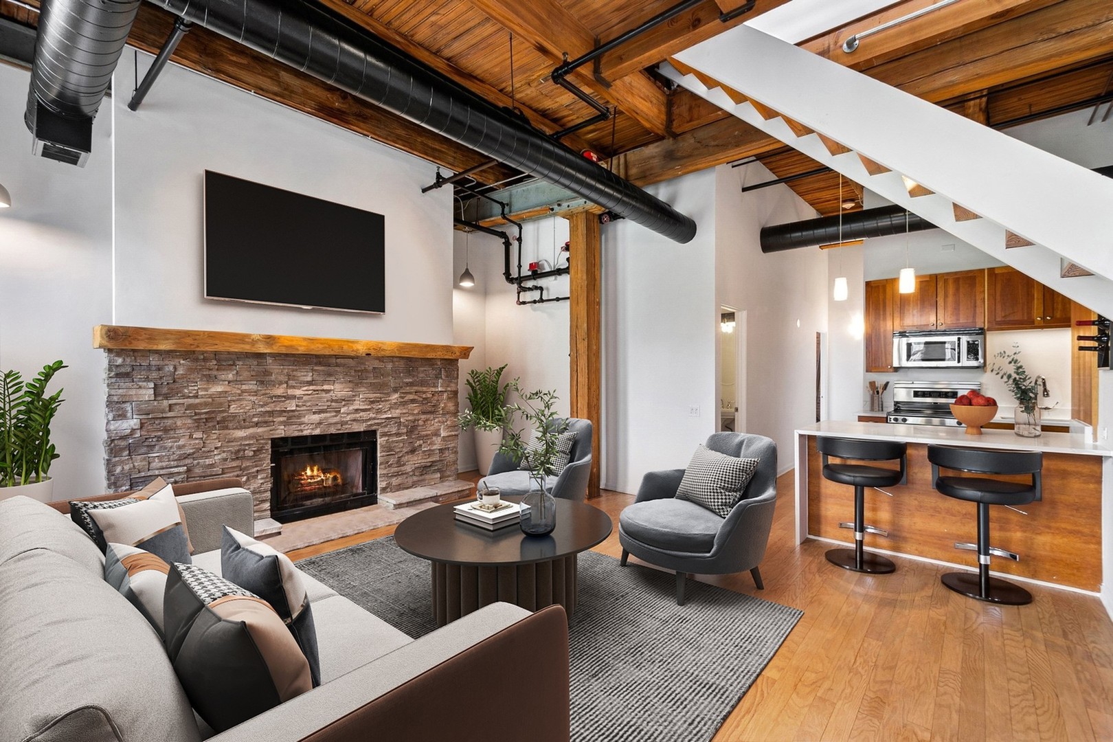 331 South Peoria Street, Unit PH6 Chicago, IL 60607 - Photo 3 of 46 a living room with furniture and a fireplace